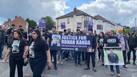 A group protesting for justice for Ronan Kanda