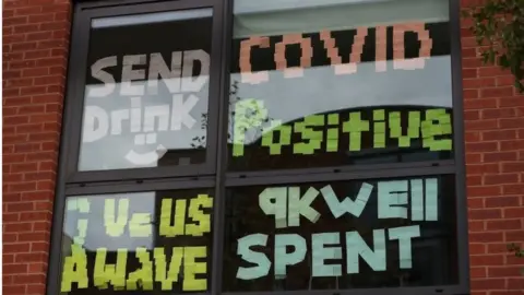 PA Media A window full of messages at Manchester Metropolitan University