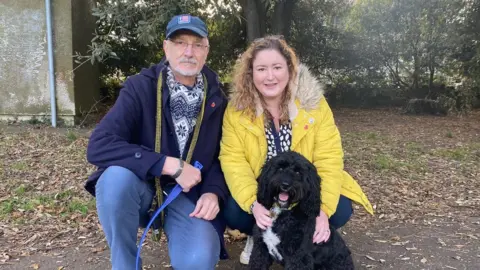 BBC Ciara and Roger Nevo with Buddy