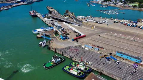 Portsmouth International Port People gather on the dock on an open day.