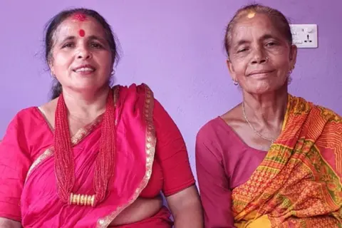 Barun Lamichhane Tulasha Lamichhane and Krishna Kumari Lamichhane, two women in traditional dress who escaped the Nepal flash floods.