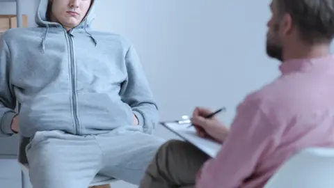 Getty Images Probation officer and offender (actors)