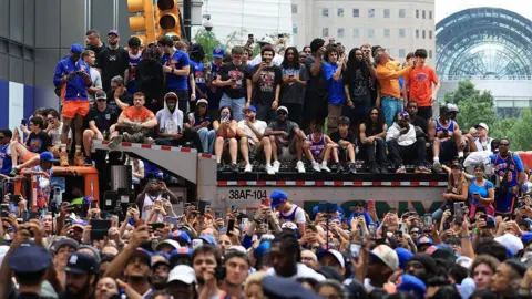 Getty Images people piled onto a truck