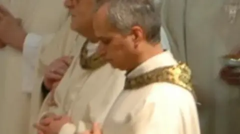 Lancaster Cathedral Pope Leo XIV is in gold and white priestly vestment