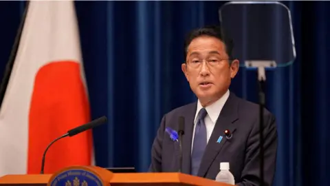 Reuters Japan's Prime Minister Fumio Kishida speaking at an event