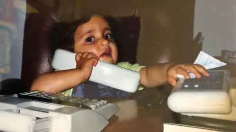 Yasmin Rufo Child speaking on phone