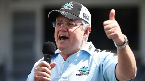 Getty Images Scott Morrison addresses the crowd during the Cronulla Sharks NRL Grand Final celebrations, 2016