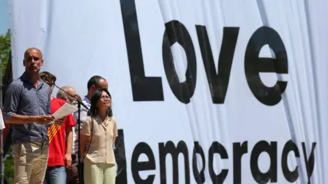 Reuters Manchester City's manager Pep Guardiola gives a speech during a pro-independence rally in Barcelona (11 June 2017)