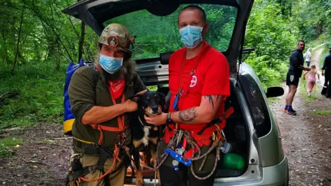 Devon Cave Rescue Organisation Freya the dog with rescuers