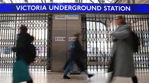 EPA Commuters at a locked Victoria station