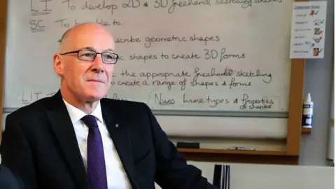 PA John Swinney in a classroom