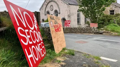 BBC Sign outside a chapel says 'no more second homes'