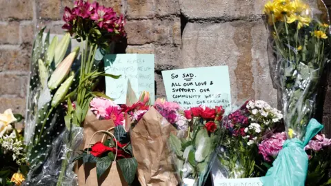 Getty Images Flowers left at the scene