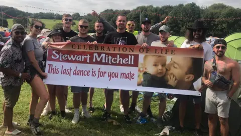 Ryan Millen Banner held in camping area