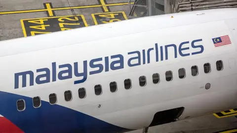 Getty Images A Malaysian Airlines Bhd. aircraft stands on the tarmac at Kuala Lumpur International Airport (KLIA) in Sepang, Selangor, Malaysia