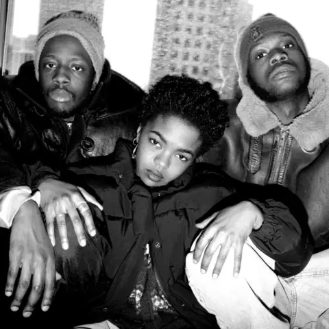 Getty Images Lauryn Hill posing with Wyclef Jean and Pras Michel in the 90s