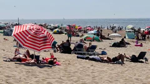 Anna Holligan Holidaymakers on a beach in The Hague, Netherlands