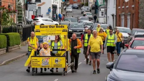 Michael Olivant Campaign bed-push in August 2023