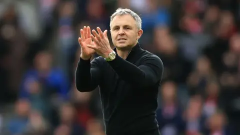 Paul Rowley claps supporters