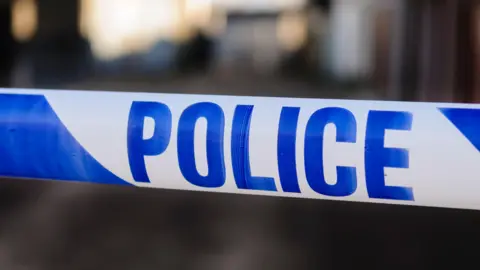 Stock image of close-up of police cordon