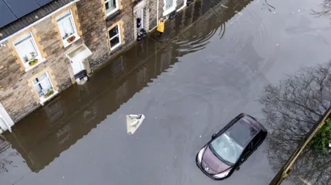 PA Flood water on Hunter Street in Briton Ferry, Neath.
