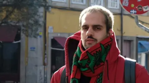 Antonio Almida Antonio Almeda a large red dupatta and coat wrapped in coat