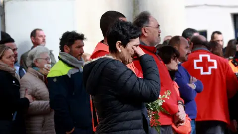 Relatives and neighbours of the Zamorano family who died in the accident in Adamuz, show their grief after the funeral mass held in their memory, in the funeral chapel installed in the Sports Pavilion of Aljaraque (Huelva), the town where they lived.