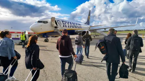 Ryanair passengers boarding a B737 airplane at Malta International Airport, Luqa.