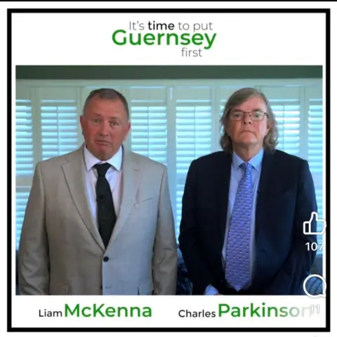 MP Liam McKenna A man in a gray suit, black tie and white shirt, looking towards the camera, stands next to a man with long gray hair, glasses, a blue patterned tie and a navy blue suit. At the bottom are the names of MPs Liam McKenna and Charles Parkinson. 