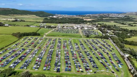 CJS PHOTOGRAPHY The car park and show field from above showing fields full of rows of cars and marquees.