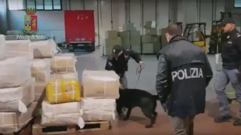 Italian police Screen grab of video shows Italian police inside a depot