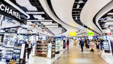 Prisma by Dukas/Getty Images Duty Free Shopping Arcade in Heathrow Airport