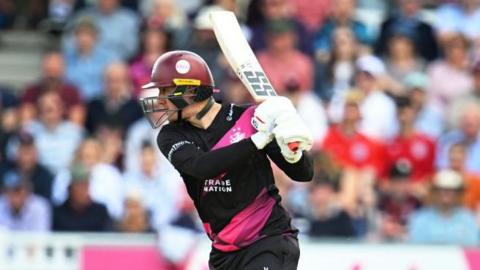 Tom Kohler-Cadmore holds his bat up ready during a game for Somerset game