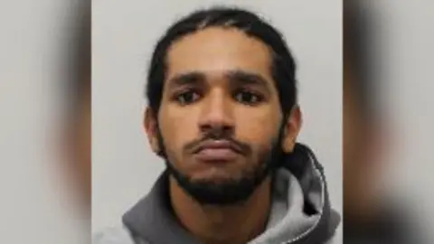 Picture of Abdel Dedour, who has dark hair, dark eyes and a short beard