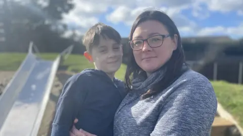 Ben Schofield/BBC Harleigh, aged nine, with his mum Maddie Roberts