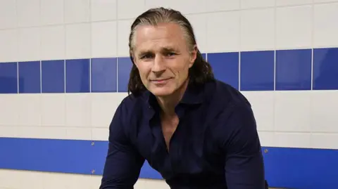 Gareth Ainsworth in the changing room at Shrewsbury Town's Croud Meadow ground