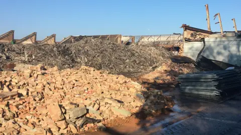 Large piles of bricks and other rubble.
