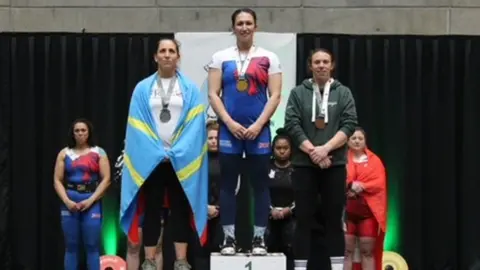Terry Baker Hannah Lewis on the podium at the European Masters