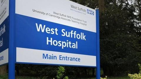 The blue and white sign at the entrance to West Suffolk Hospital