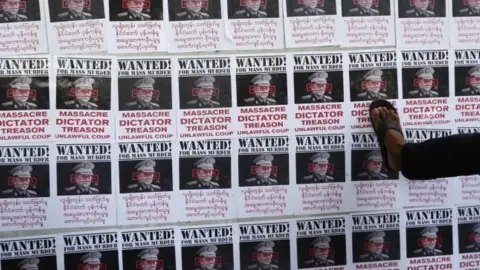 EPA Mock "wanted" posters show the leader of Myanmar's military