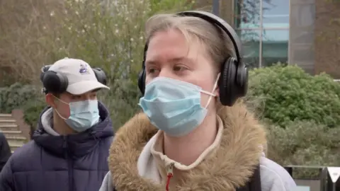 A female student wearing a face mask 