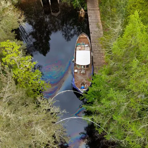 George Finlayson An aerial image showing the boat and an oily-like sheen coming from it.