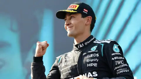 George Russell celebrates winning the Austrian Grand Prix 