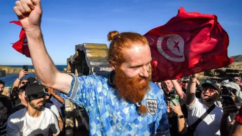 Russ Cook at the finish line in April after running the length of Africa 