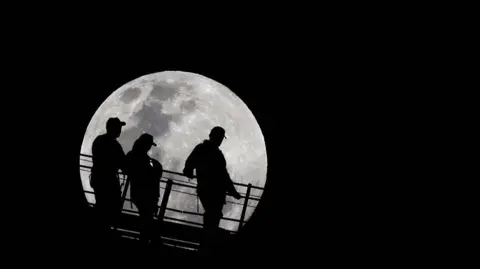 Walkers walk across Sydney Harbour Bridge