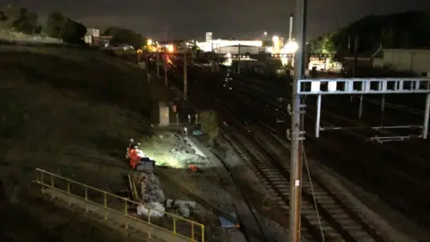 BBC Railway engineers consider damage to tracks and lines at Stevenage station