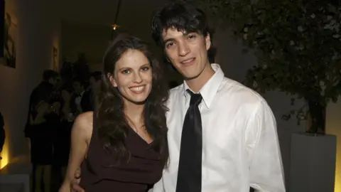 Getty Images Adi Neumann and Adam Neumann attend Molly Sims Hosts OPERATION SMILE, "The Smile Collection" Benefit featuring the J. MENDEL Spring 2006