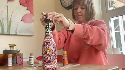 Beth finishes one of her mandala art works