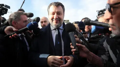 Reuters Matteo Salvini arrives at a court in Sicily where he is surrounded by reporters ahead of a verdict in a long-running trial