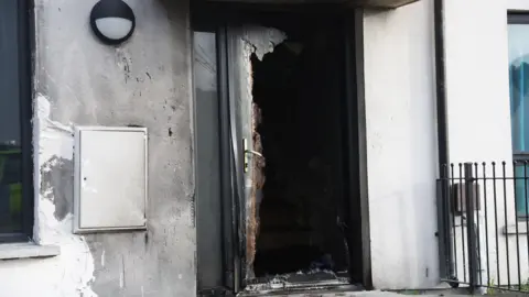 Pacemaker Close up of door of a house in Weaver's Grange in Newtownards which has been extensively damaged in a fire. There is also smoke damage on the wall to the left of the door